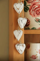 Four Antique White Wooden Hearts on Jute String