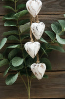 Four Antique White Wooden Hearts on Jute String